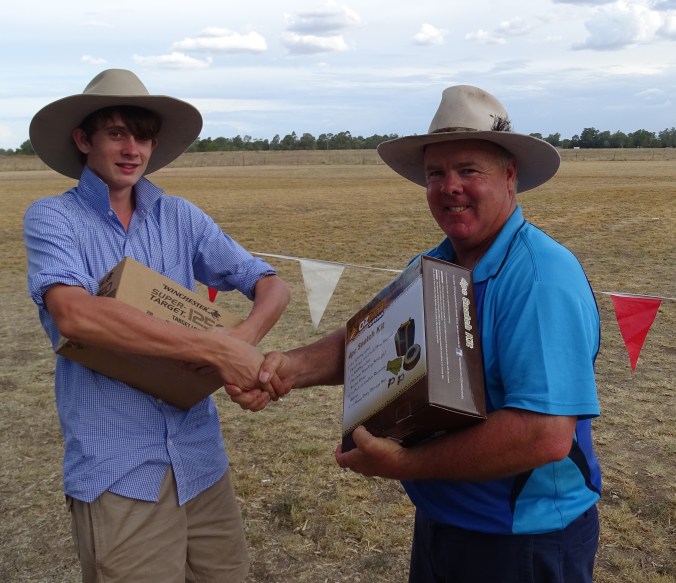 Blake Schwartz being congratulate by Warren club President David O'Brien